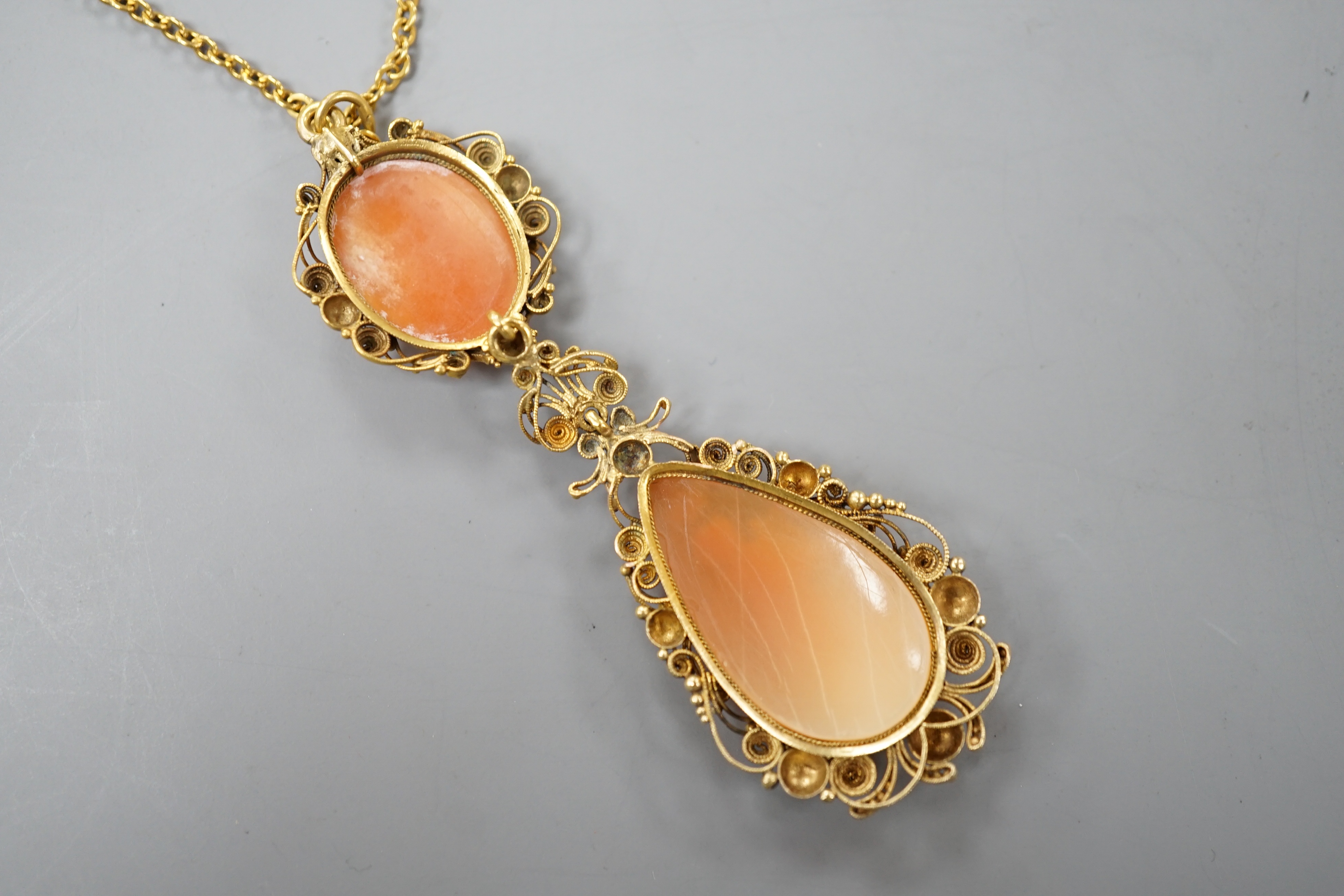 A 9ct and cameo shell set drop pendant necklace, 70cm, gross weight 10.9 grams.